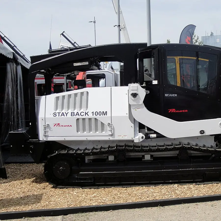 A tracked forestry mulcher with a front mulching head (stock photo)
